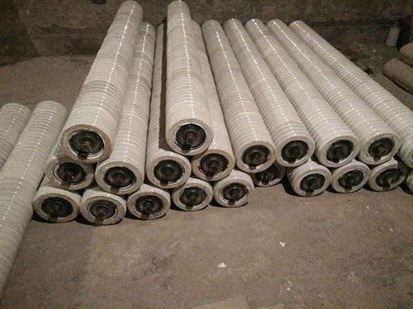 Stacked ceramic idler rollers with wear-resistant ceramic surface
