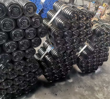 Impact conveyor rollers stacked in factory