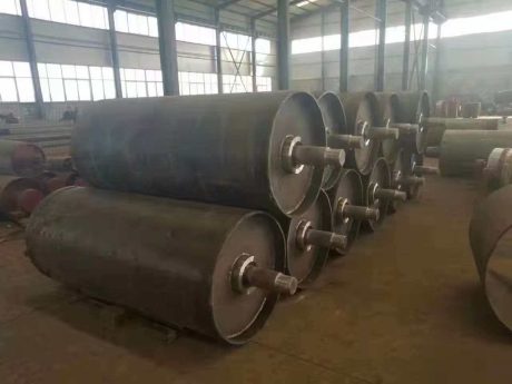 Finished conveyor pulleys in factory workshop